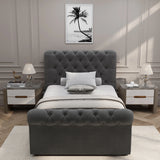 Front view of single Chesterfield Ottoman Storage Bed in dark grey, featuring plush tufted upholstery and elegant design.