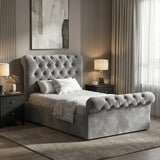 [Single | Dark Grey] Side view of Chesterfield ottoman bed with buttoned grey velvet headboard and scroll footboard