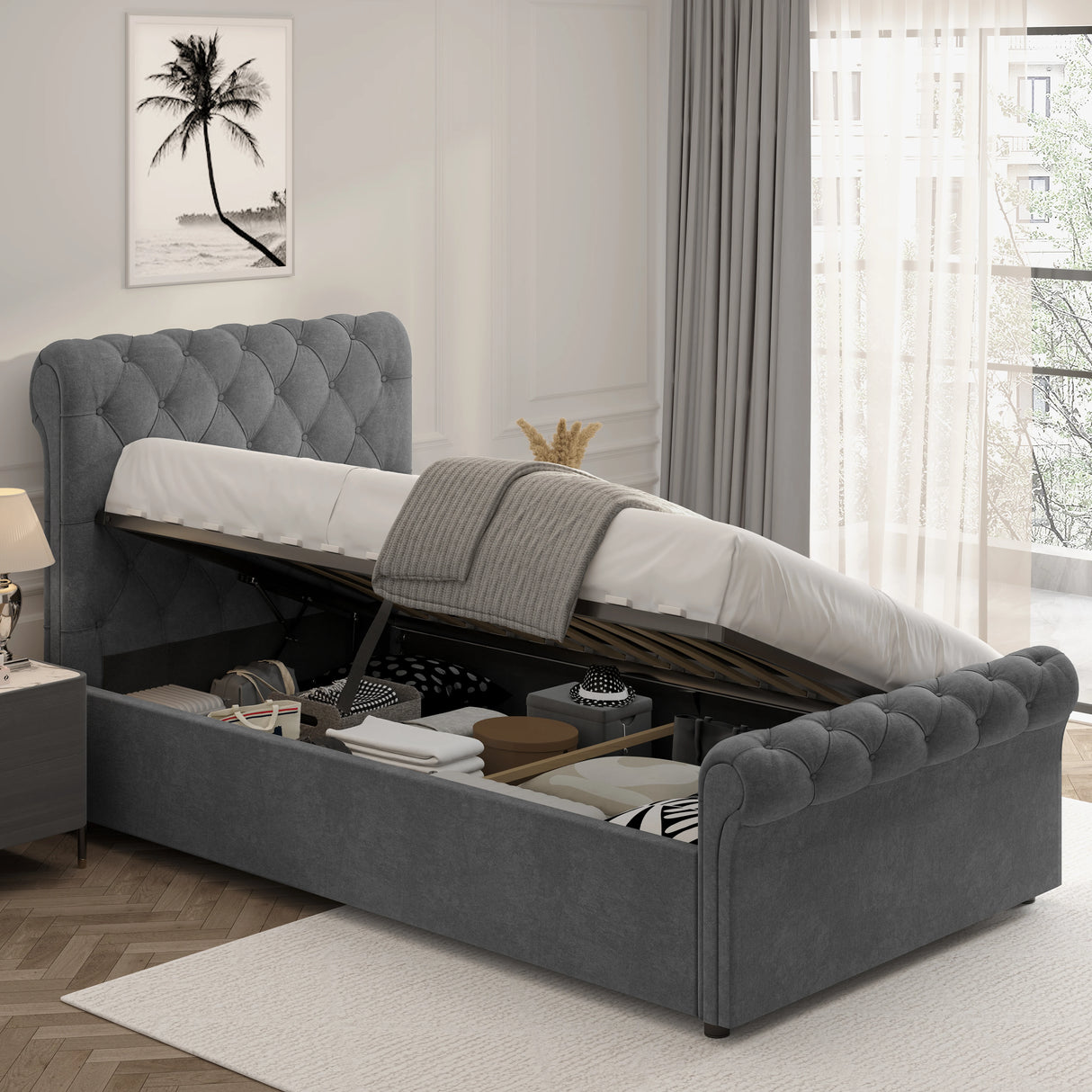 Chesterfield Ottoman Storage Bed with side lift in dark grey velvet, featuring a tufted headboard and ample under-bed storage for bedding and boxes.