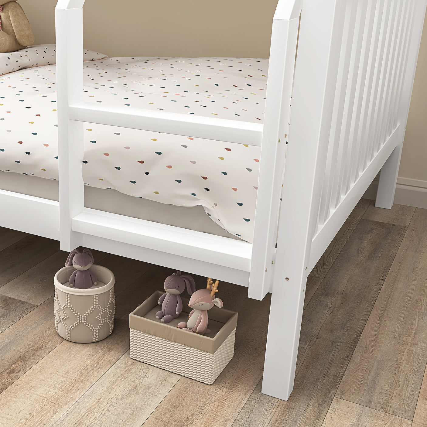 Close-up of under-bed storage space beneath white bunk bed, showing room for toy baskets and kids' storage solutions.