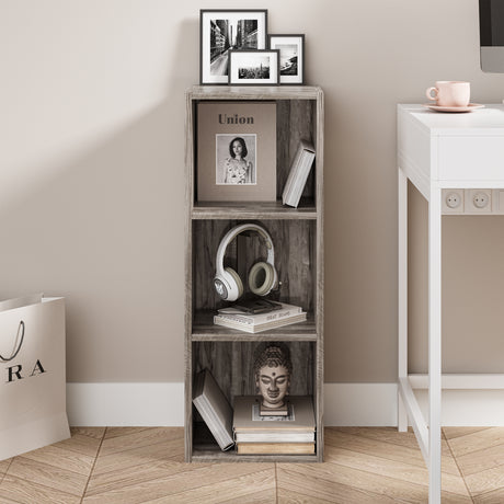 front view of coach wood slimline bookcases holding books and ornaments, ideal for compact living