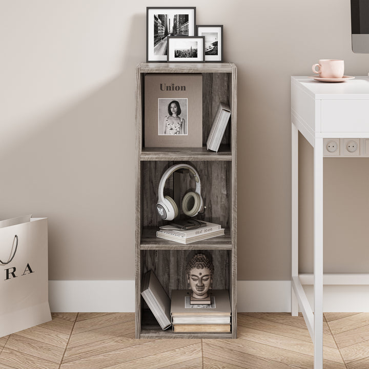 [3 Shelf | Coach Wood] front view of coach-wood-grain console-height bookcase set behind terracotta planter pot