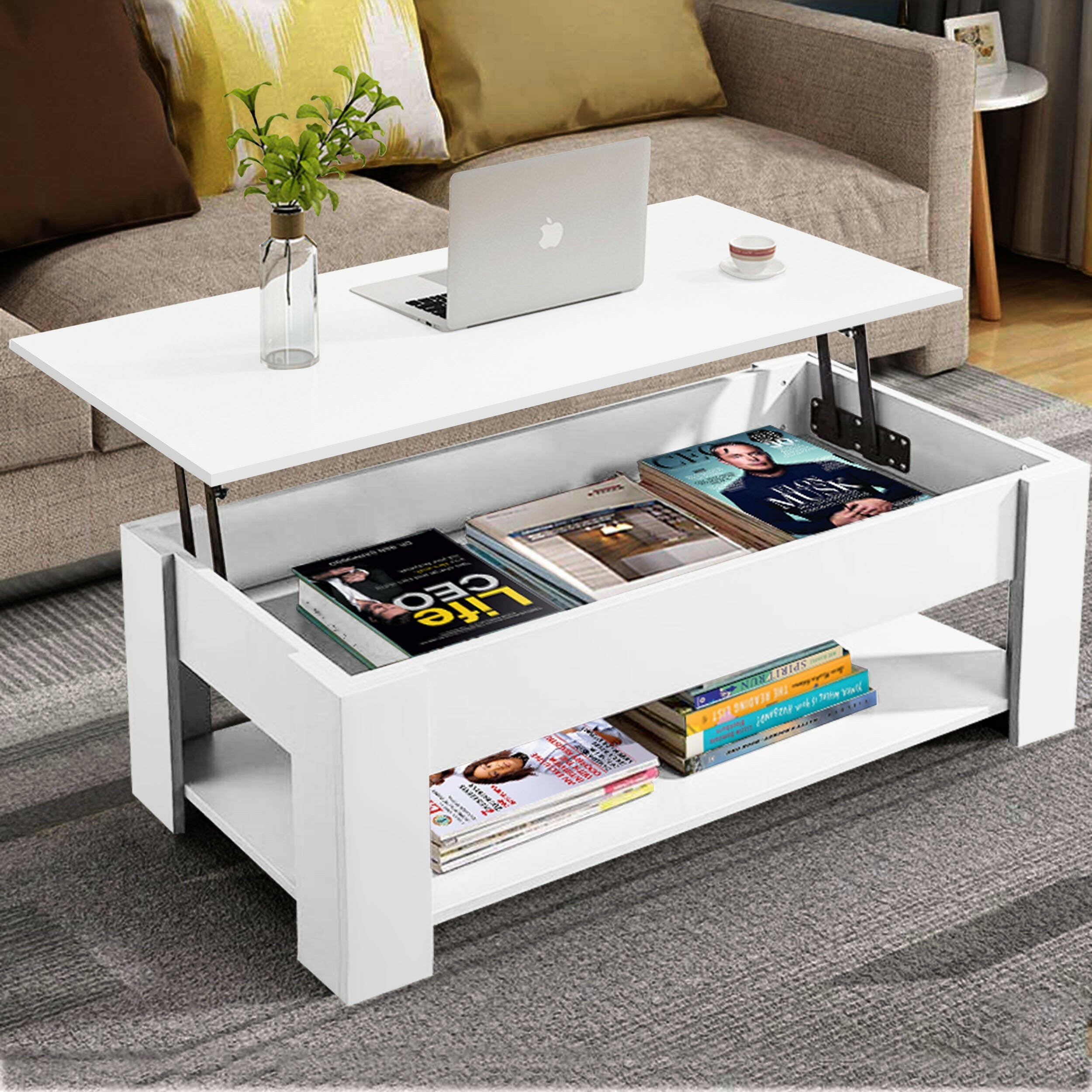 White coffee table modern design with a lift-top, storage space, and books on the lower shelf.