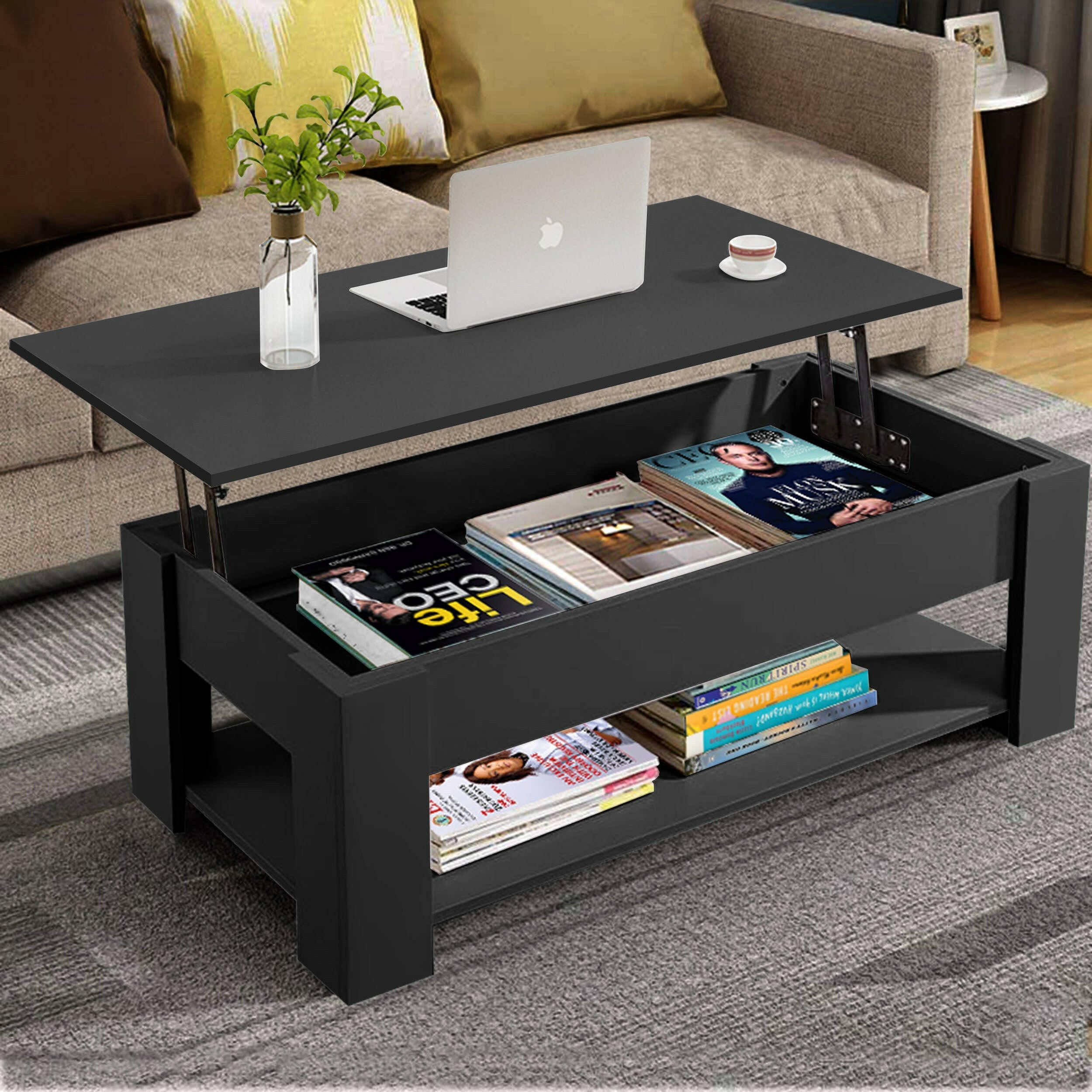 Black coffee table with storage and lift top, ideal for living room use with books and decor