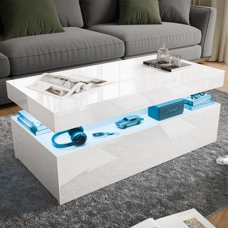 Modern white coffee table with electronic devices on a gray rug in a living room.