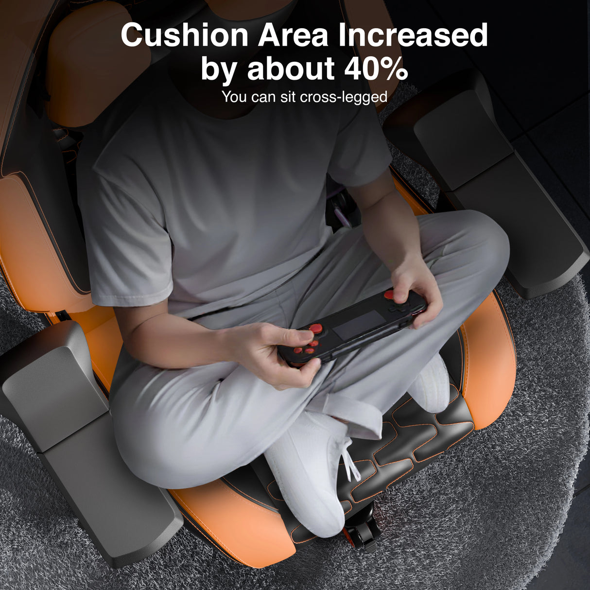 Person sitting cross-legged on a massage chair with text indicating increased cushion area.