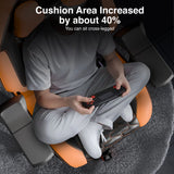 Person sitting cross-legged on a massage chair with text indicating increased cushion area.
