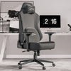 Xstriker ergonomic home office chair in grey setup with high back design, ideal for gaming or workstations with modern decor.