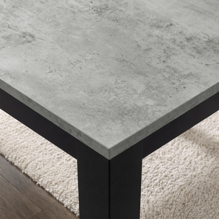 [140cm | Concrete] Close-up of stone-effect tabletop grain, beveled edge, square leg, and textured rug