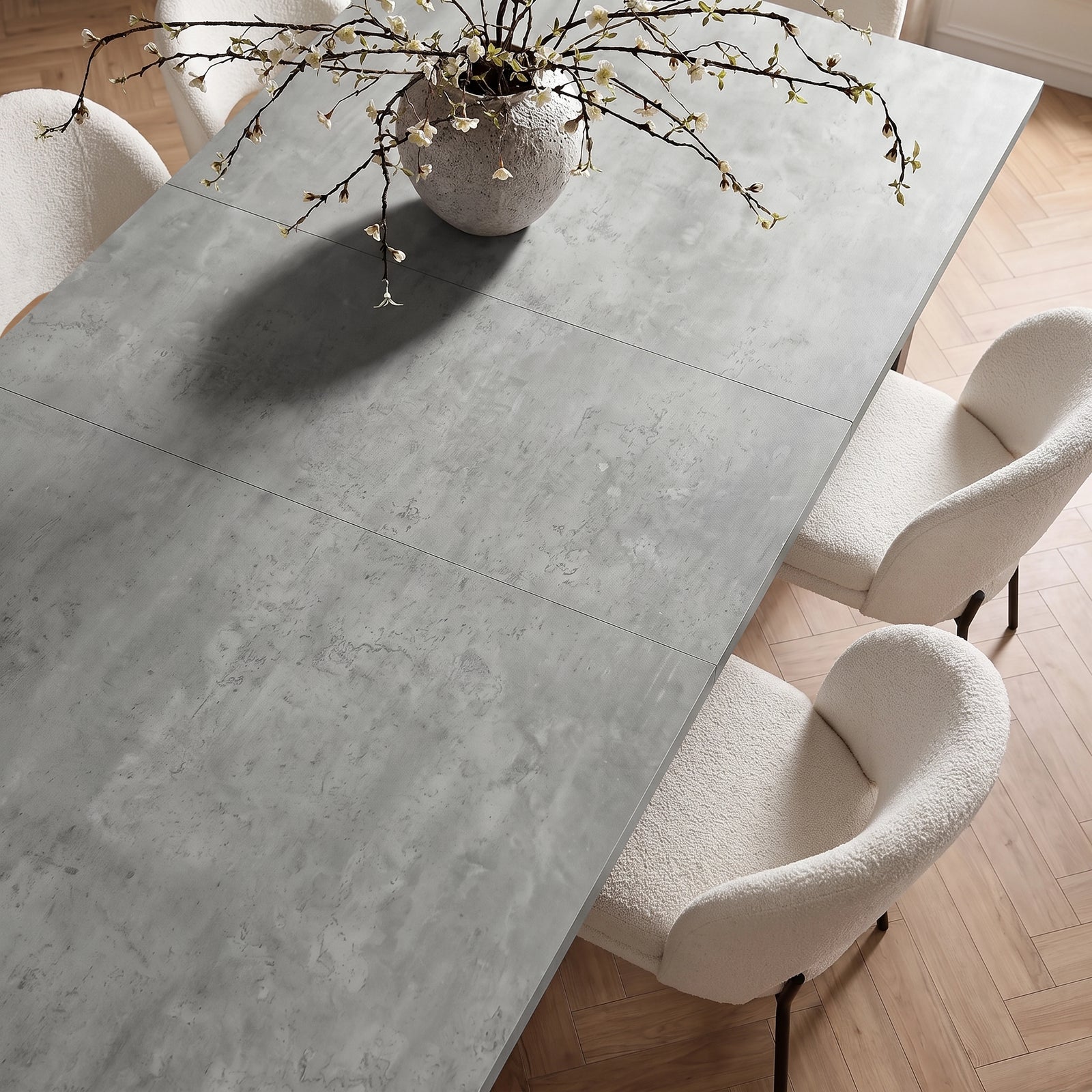 [140cm | Concrete] 180cm extended dining table top with 40cm centre leaf, concrete effect, cream chairs and blossom vase.