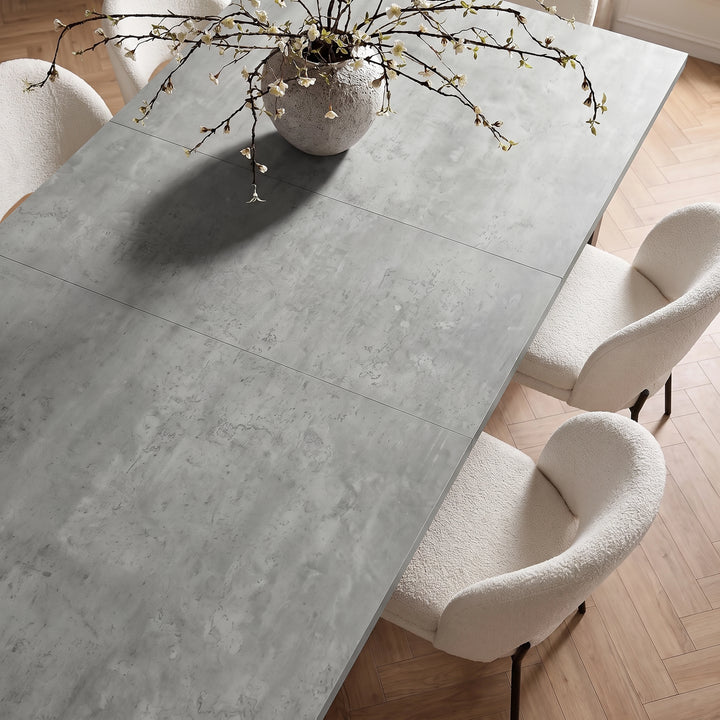 [160 cm | Concrete] Extended dining table top with 40cm centre leaf, mottled concrete finish, cream chairs and flower vase.
