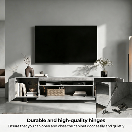 [Concrete] Kystra TV stand with both cabinet doors open showing full storage interior, with a close-up inset of the chrome soft-close hinge mechanism highlighted with an orange circle
