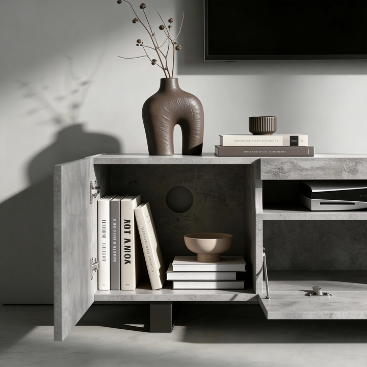 [Concrete] Kystra TV stand left compartment open, dark vase with stems on top and AV gear in centre