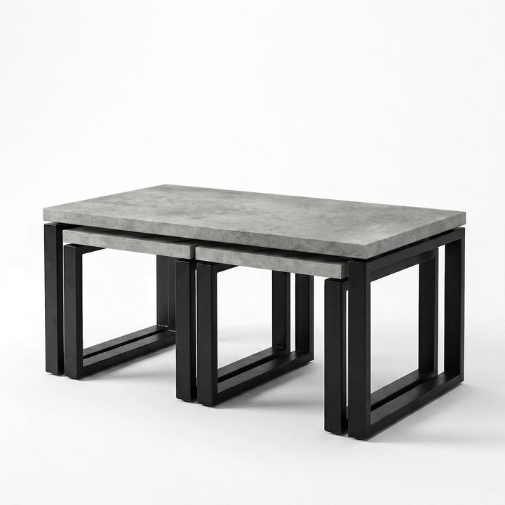 [Concrete] Nestline nesting table view showing three-piece nested coffee table set on a clean white background from a side