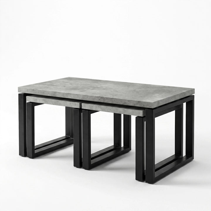 [Concrete] Nestline nesting table view showing three-piece nested coffee table set on a clean white background from a side
