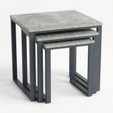 [Concrete] Stackora set of 3 nesting tables from front angle showing all three graduated concrete-effect tops nested within each other