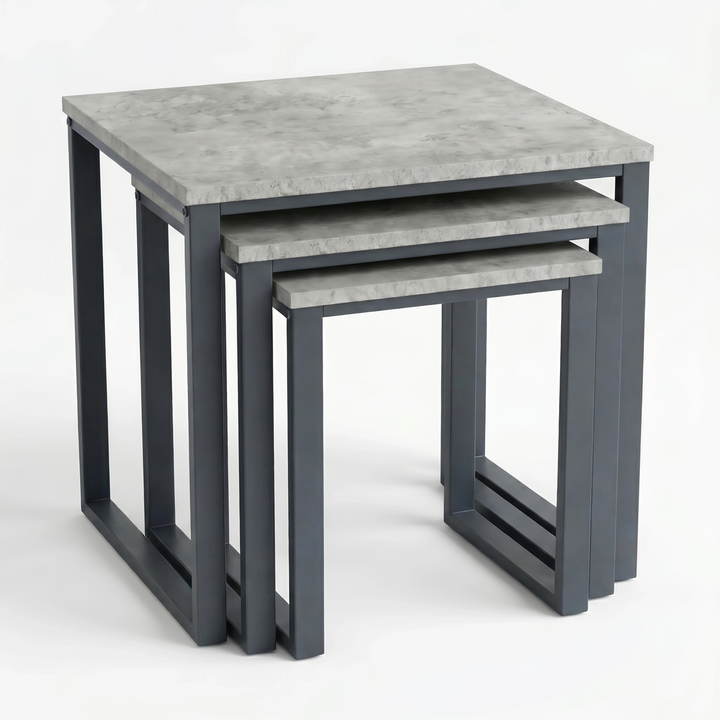[Concrete] Stackora set of 3 nesting tables from front angle showing all three graduated concrete-effect tops nested within each other