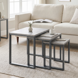[Concrete] Stackora nest of tables set of 3 arranged in a living room with sofa, rug, vase and books styled across all three surfaces