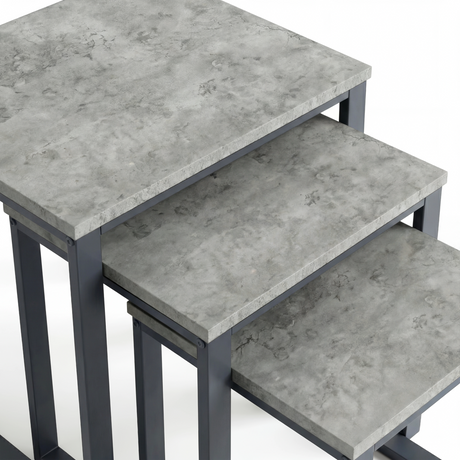 [Concrete] Stackora set of 3 nest of tables top-down close-up showing light grey concrete-effect texture and subtle veining across all three surfaces