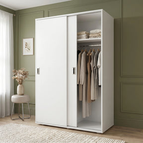 [Cool White] Torvek large sliding wardrobe side angled view in bright neutral bedroom with sheer curtains