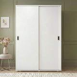 [Cool White] Torvek large sliding wardrobe fully closed front view in neutral bedroom with chrome recessed handles