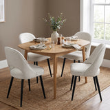[Cream | Set of 2] Two pairs of the comfy cream dining chairs at a square wood table styled with tableware & vase.