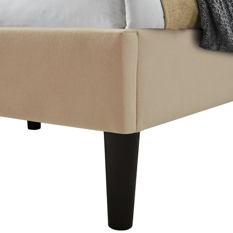 Cream double bed frame with soft upholstered fabric and sturdy black wooden legs.