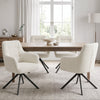 [Cream | Set of 4] Four swivel dining chairs around a pale wood table styled with two stone bowls in a bright dining room.