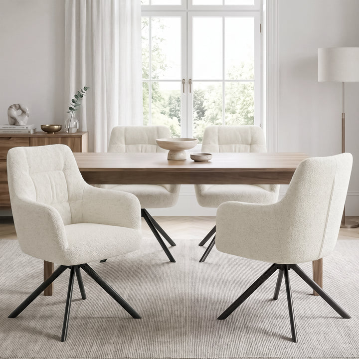 [Cream | Set of 4] Four swivel dining chairs around a pale wood table styled with two stone bowls in a bright dining room.
