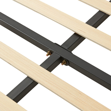 Cream wooden bed frame slats with sturdy black metal support for enhanced durability.