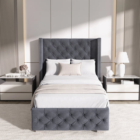 Front view of single dark grey velvet ottoman bed with cross pattern and winged headboard, styled in a modern bedroom.