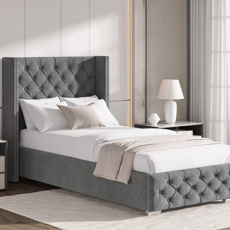 Light grey single velvet ottoman bed with cross pattern and winged headboard, styled with neutral bedding and decor.