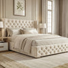 [King | Beige] Cross ottoman bed side-angle, diamond-tufted headboard and footboard on oak-tone flooring