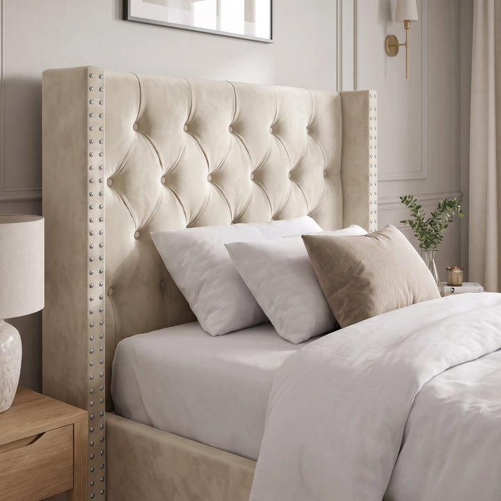 [Single | Beige] Detail shot of Cross ottoman bed headboard showing buttoned diamonds and nailhead studs