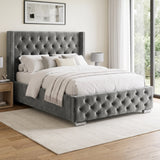 [Double | Grey] cross tufted velvet bed frame with silver nailhead trim and silver metal legs, styled in a bright bedroom with white bedding, a light rug, and wooden flooring.