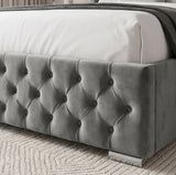 [King | Grey] gray tufted velvet bed frame with white bedding and a patterned rug.