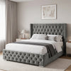[King | Grey] Cross ottoman bed shown from side with tall buttoned wingback and matching tufted footboard