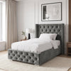 [Single | Grey] Cross ottoman bed single, side angle with cushions and throw on tufted platform