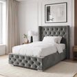 [Single | Grey] Cross ottoman bed single, side angle with cushions and throw on tufted platform