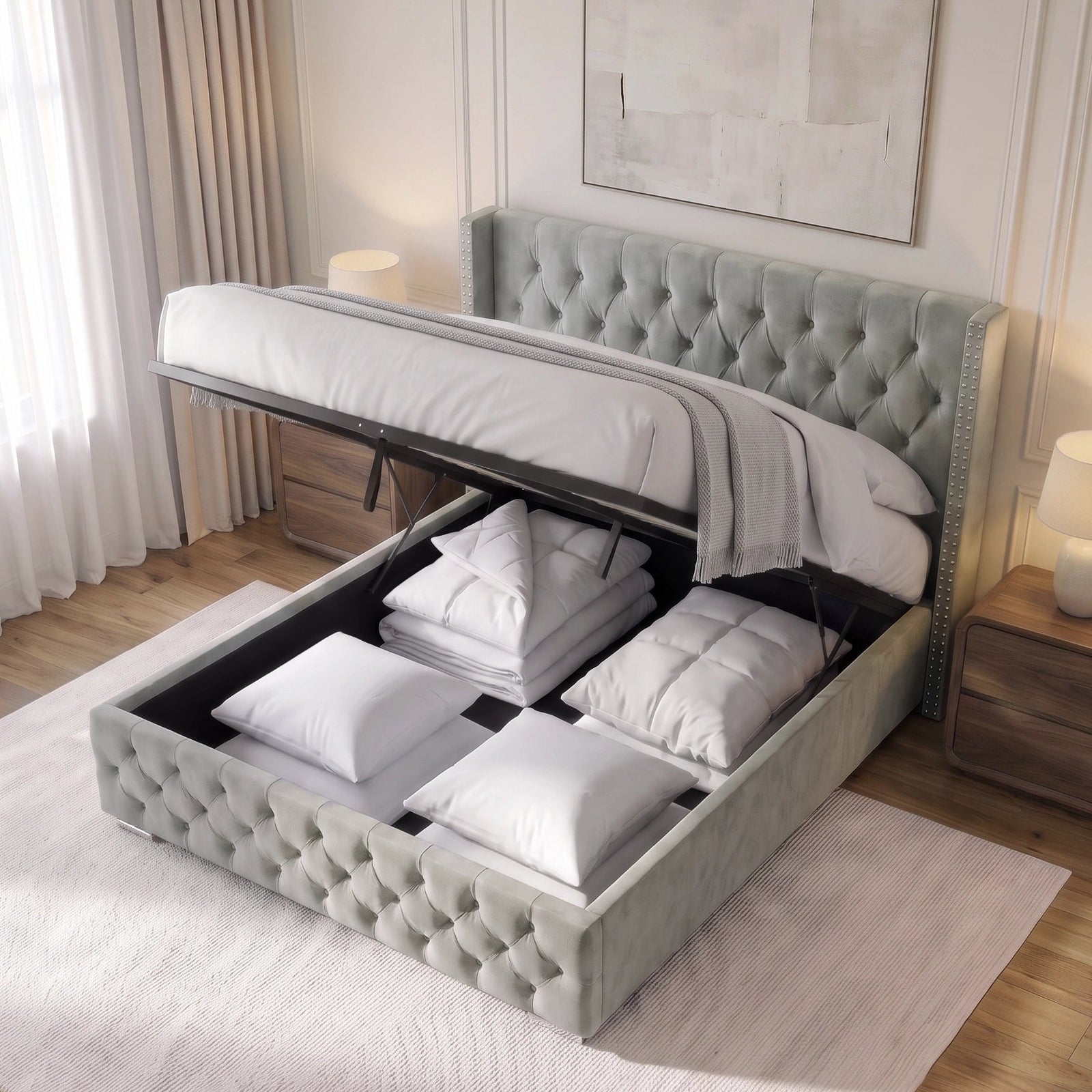 [King | Light Grey] tufted storage bed frame with the lift-up lid open, showing white bedding and folded linens stored inside, set in a bright bedroom with a window, rug, and bedside table.