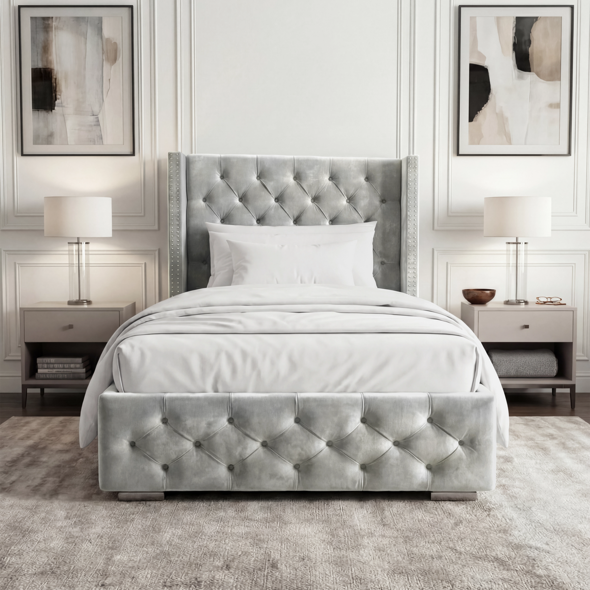 [Single | Light Grey] Front view of cross ottoman bed with winged headboard flanked by matching bedside tables and lamps