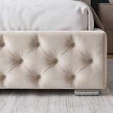 [Small Double | Beige] Close-up of a tufted upholstered bed frame in beige velvet, with a white sheet and pillow visible at the top and a gray textured rug underneath.