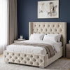 [Small Double | Beige] Side angle of Cross ottoman bed showing nailhead-studded wings and diamond-tufted base