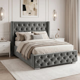 [Small Double | Grey] velvet bed frame with a high wingback headboard and matching footboard, styled in a modern bedroom with white nightstands, beige curtains, and wall sconces.