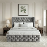 [Small Double | Grey] Front view of cross ottoman bed with winged headboard flanked by matching bedside tables