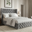 [Small Double | Grey] Side angle of Cross ottoman bed, studded wingback with tufted panels and matching footboard