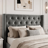 [Small Double | Grey] tufted velvet wingback headboard with silver nailhead trim, shown on a bed styled with neutral beige and gray bedding in a bedroom setting.