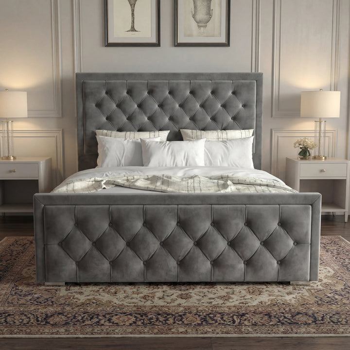 [Double | Grey] Front view of cross-puffed ottoman bed centred between matching nightstands with crystal lamps