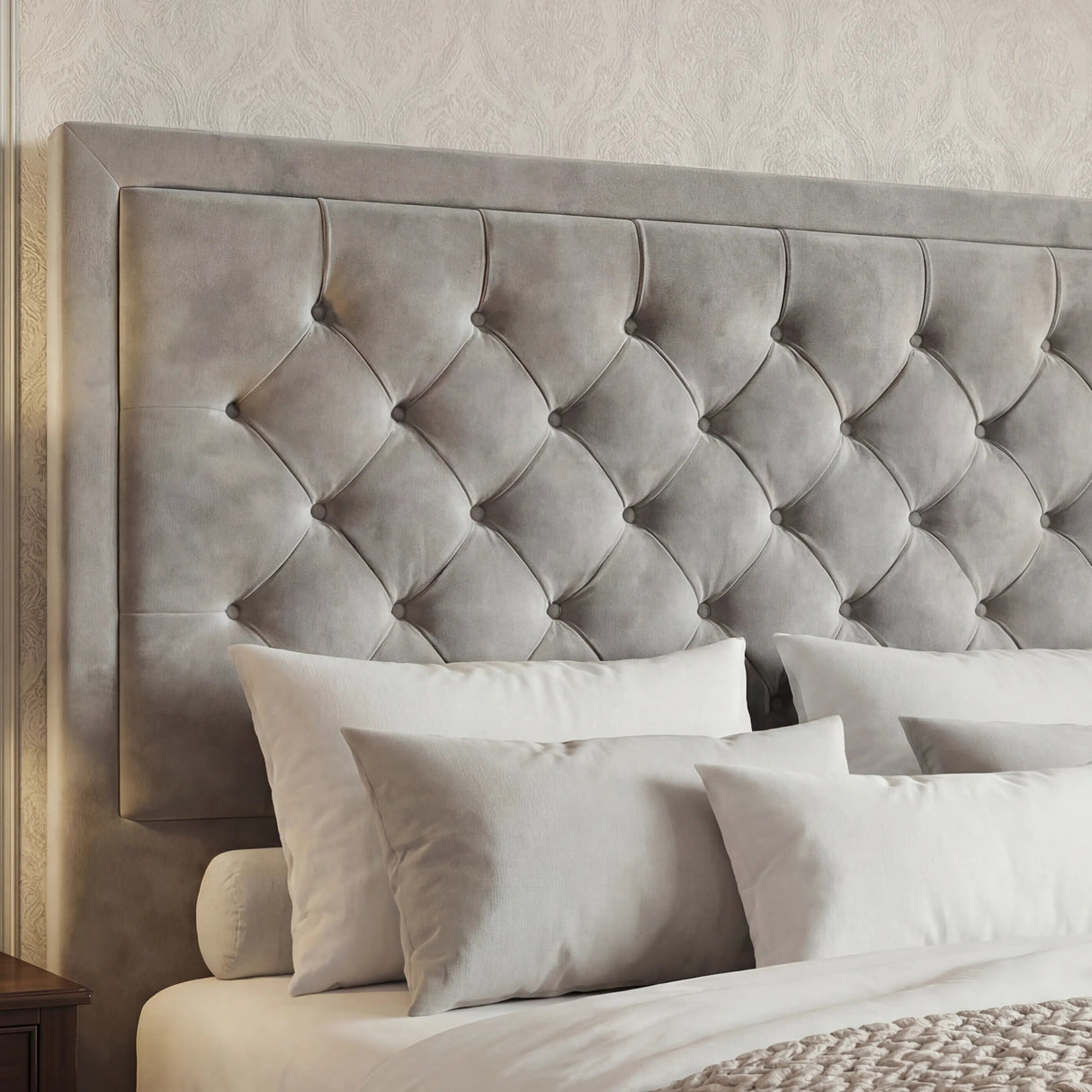 [Double | Light Grey] Close-up of deep chesterfield button-tufted headboard with puffed diamond velvet panels
