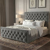 [King | Grey] Side angle of velvet ottoman bed with deep chesterfield button-tufted headboard and matching footboard